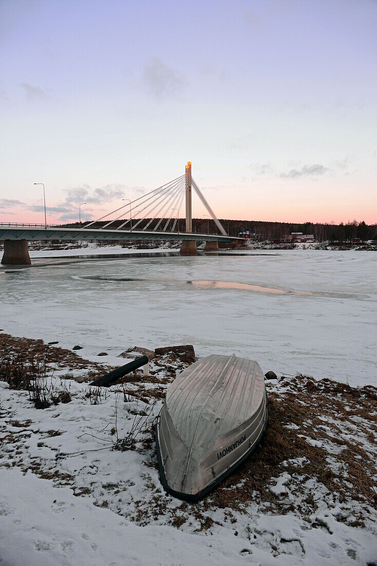 Frozen Kemijoki river at sunset, Rovaniemi.