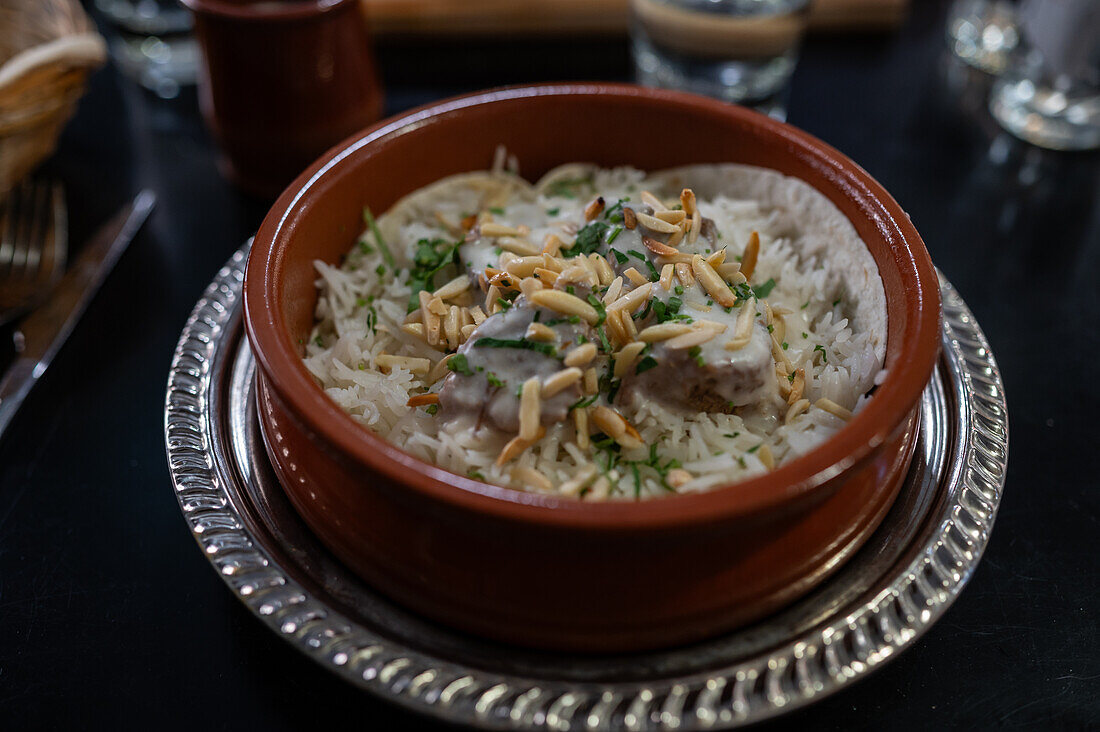 Mansaf, traditional Levantine dish made of lamb cooked in a sauce of fermented dried yogurt and served with rice or bulgur, Mosaico Restaurant, Zaragoza, Spain