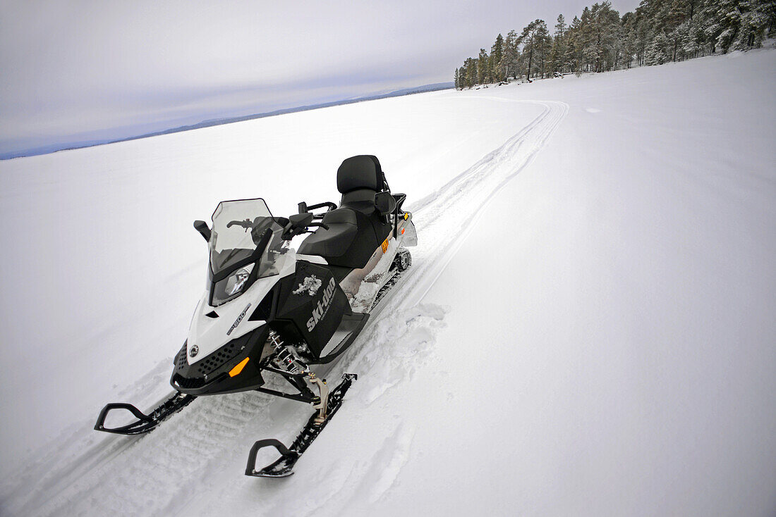 Snowmobile experience through wilderness of Lake Inari with VisitInari, Lapland, Finland