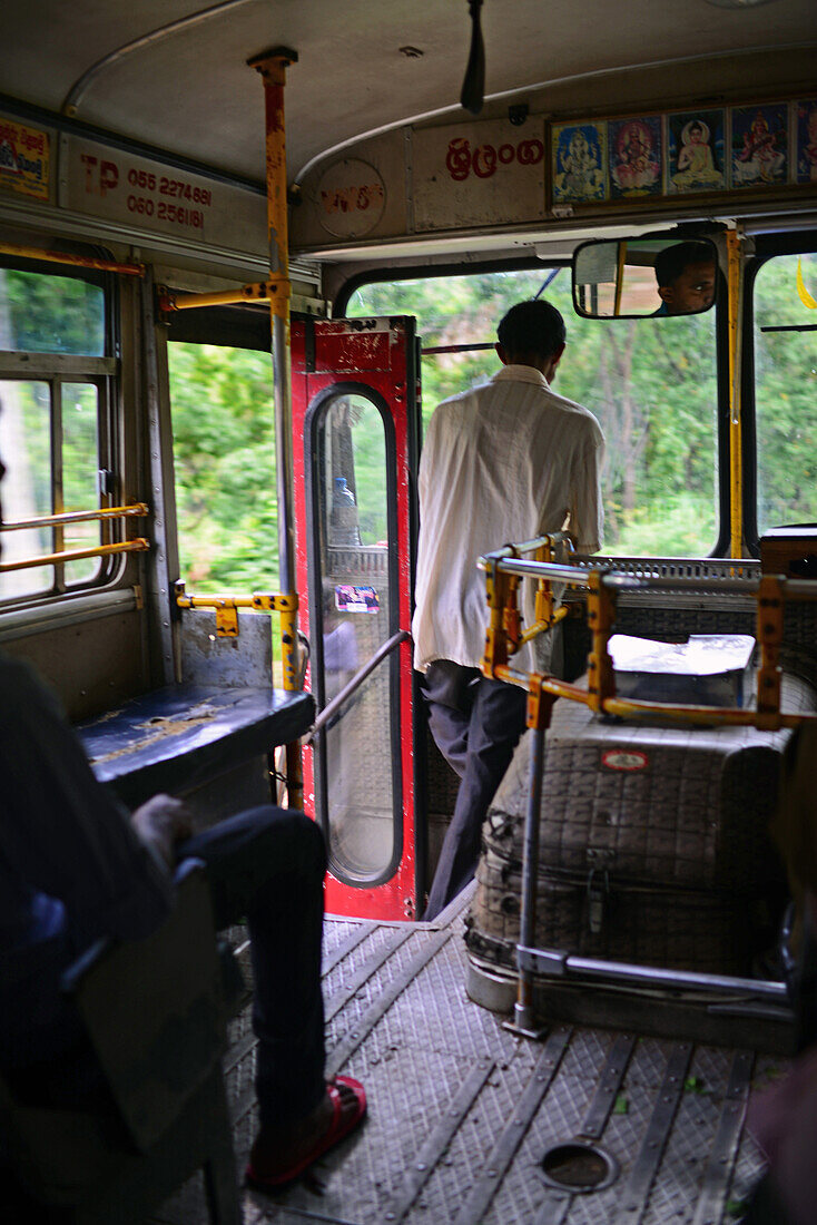 Bus conductor in Nuwara Eliya, Sri Lanka