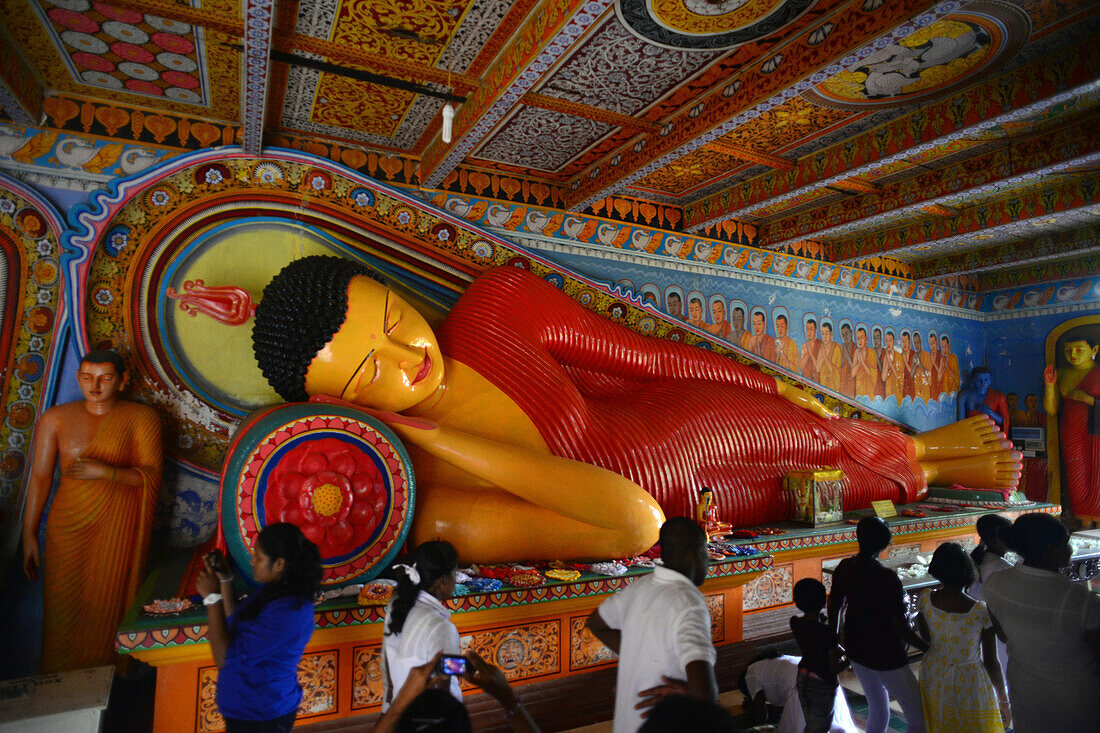 Reclining buddha statue at the Isurumuniya Temple in Anuradhapura, Sri Lanka.