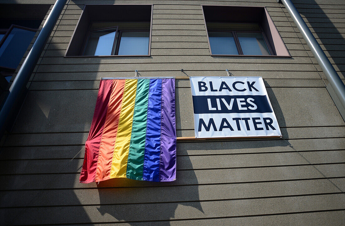 Black lives matter sign and gay flag on building. San Francisco, California.