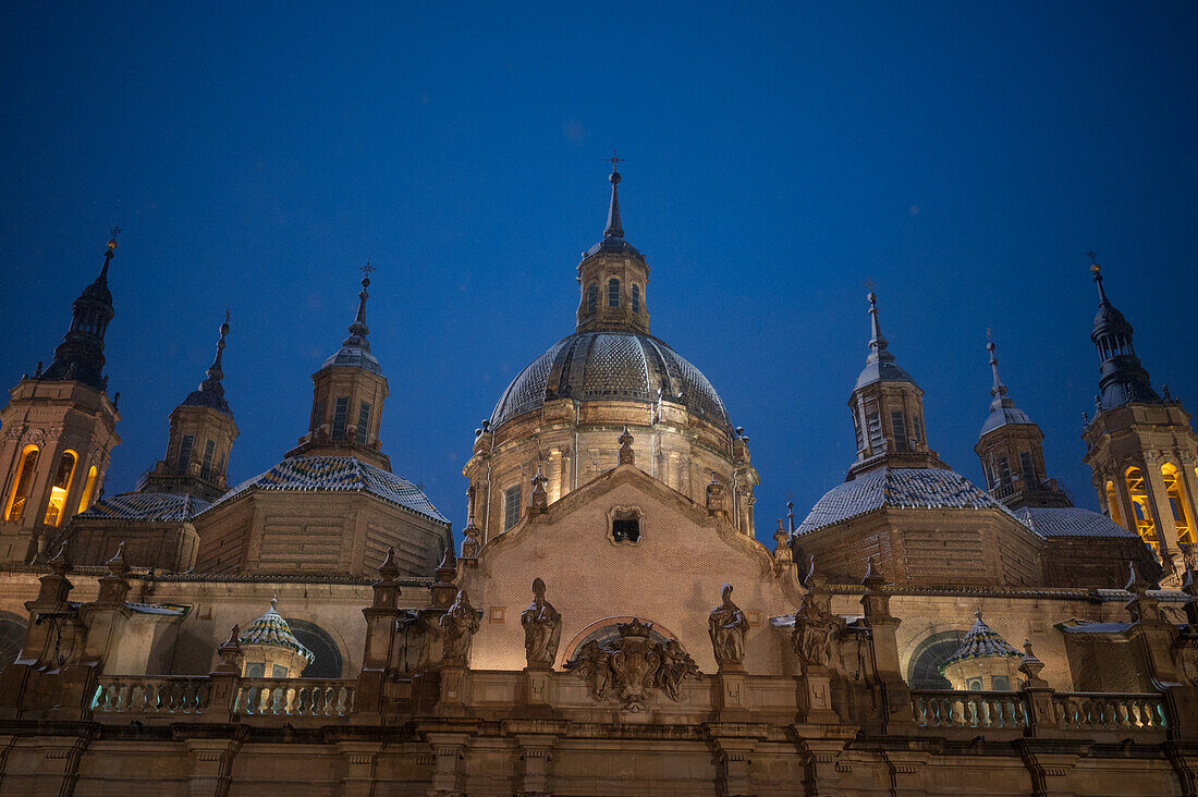 Snow falls over El Pilar Basilica during Storm Juan in Zaragoza, Spain