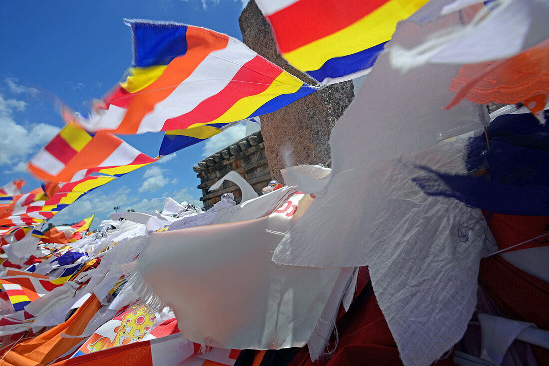 Prayer flags in Ruwanwelisaya, a stupa in Anuradhapura, Sri Lanka, considered a marvel for its architectural qualities and sacred to many Buddhists all over the world.