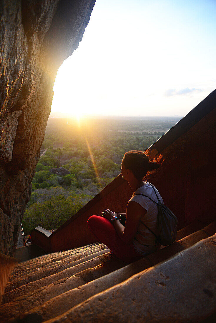 Young woman in the stairs up to the Ancient City of Sigiriya, Sri Lanka