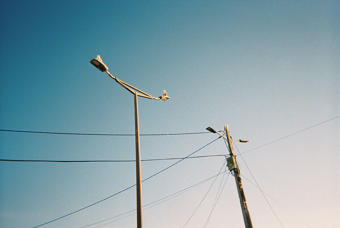 Analog photograph of two streetlights in Portugal