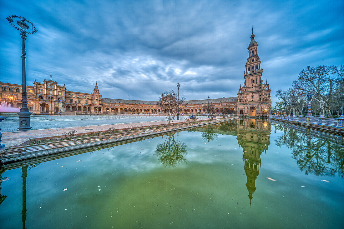 Stunning Twilight Scene at Historic Plaza de España with Reflective Waters, Seville, Spain