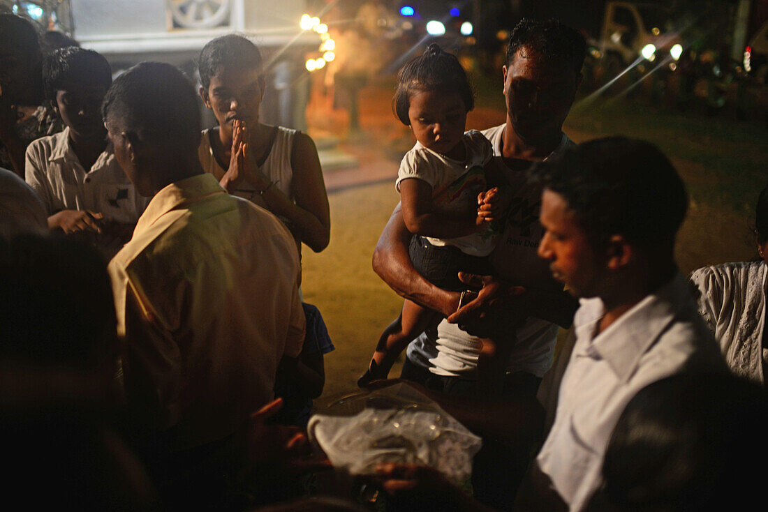 People pray during Buddhist event at UNESCO World Heritage, Galle Fort, during Binara Full Moon Poya Day.