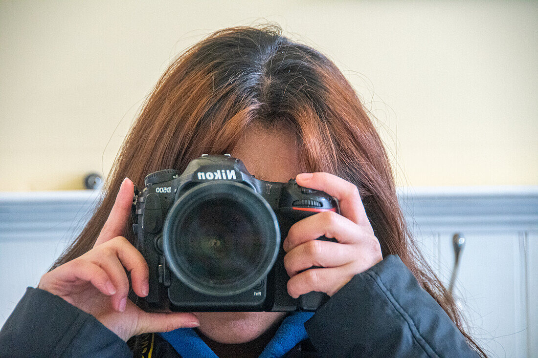 Girl taking mirror picture with camera