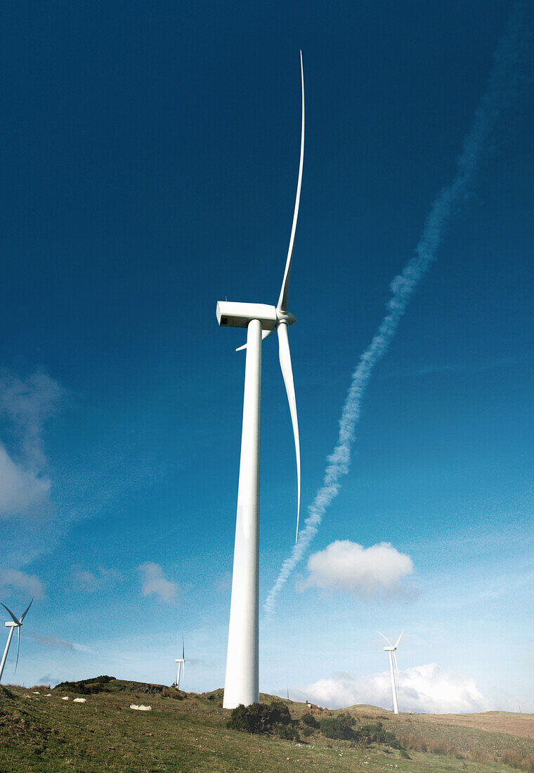 Wind turbines against blue sky