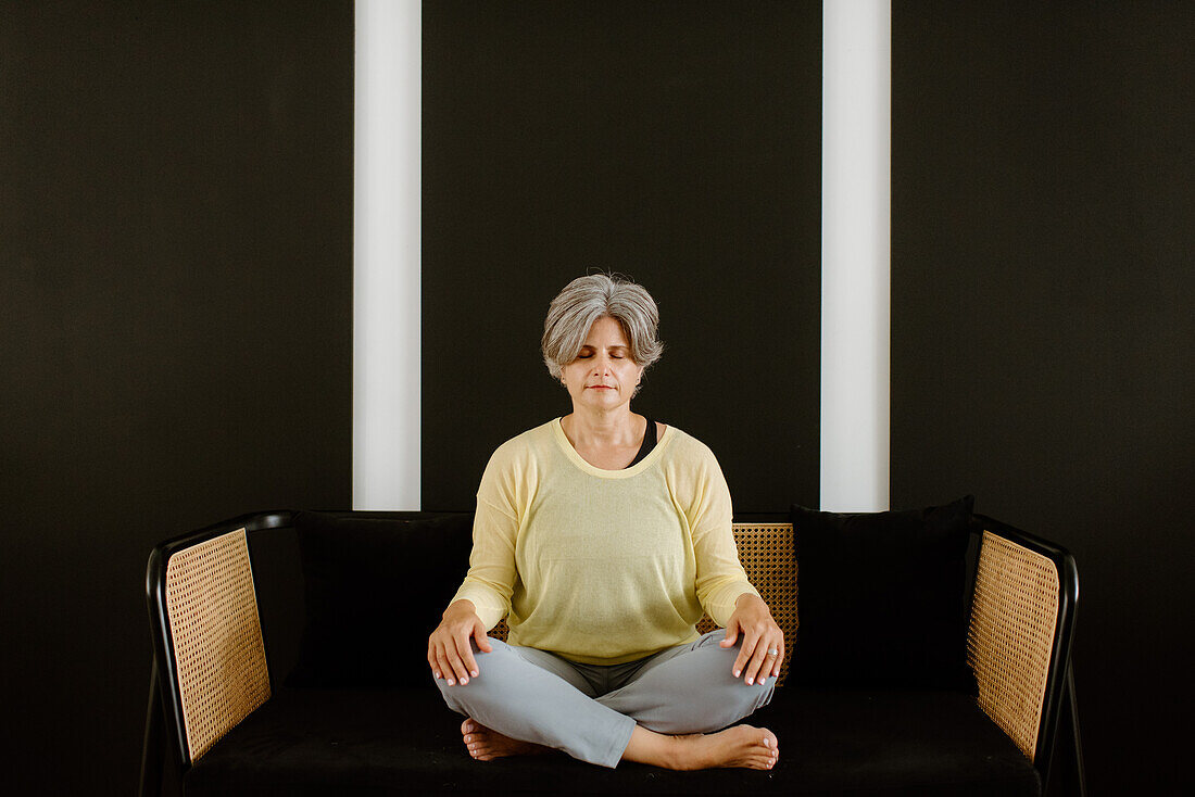 Woman meditating at home