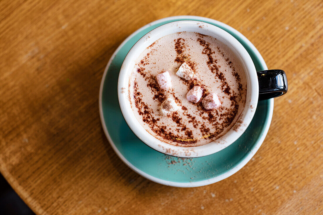 Overhead view of cup of hot chocolate with marshmallows