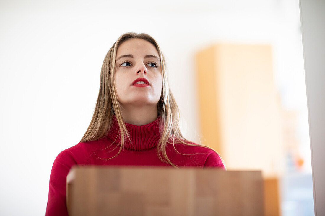 Young woman with laptop at home