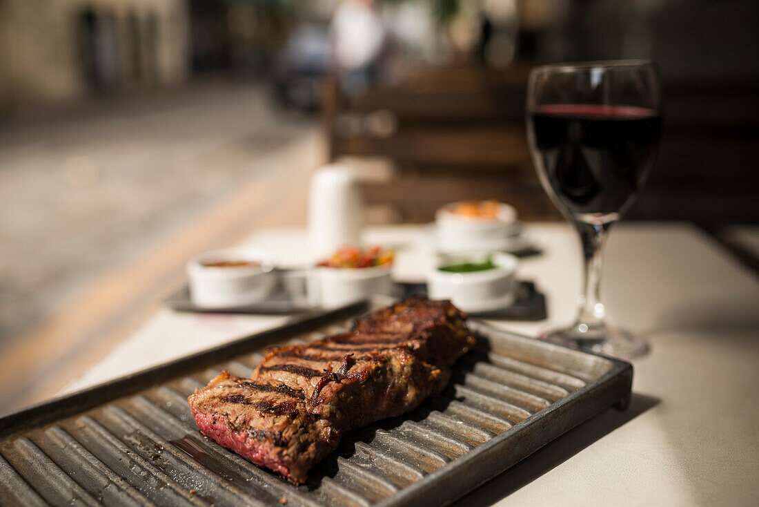 Argentina, Buenos Aires, Steak meal at traditional parrillia