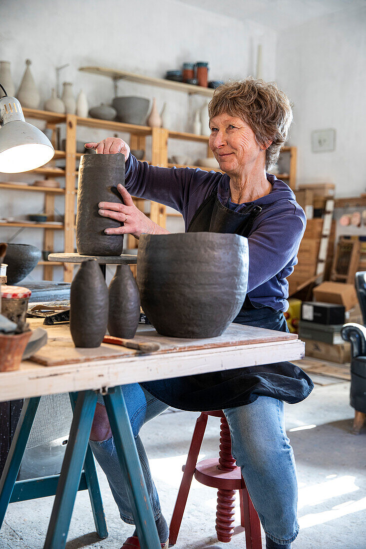 Spain, Baleares, Woman making ceramics in workshop