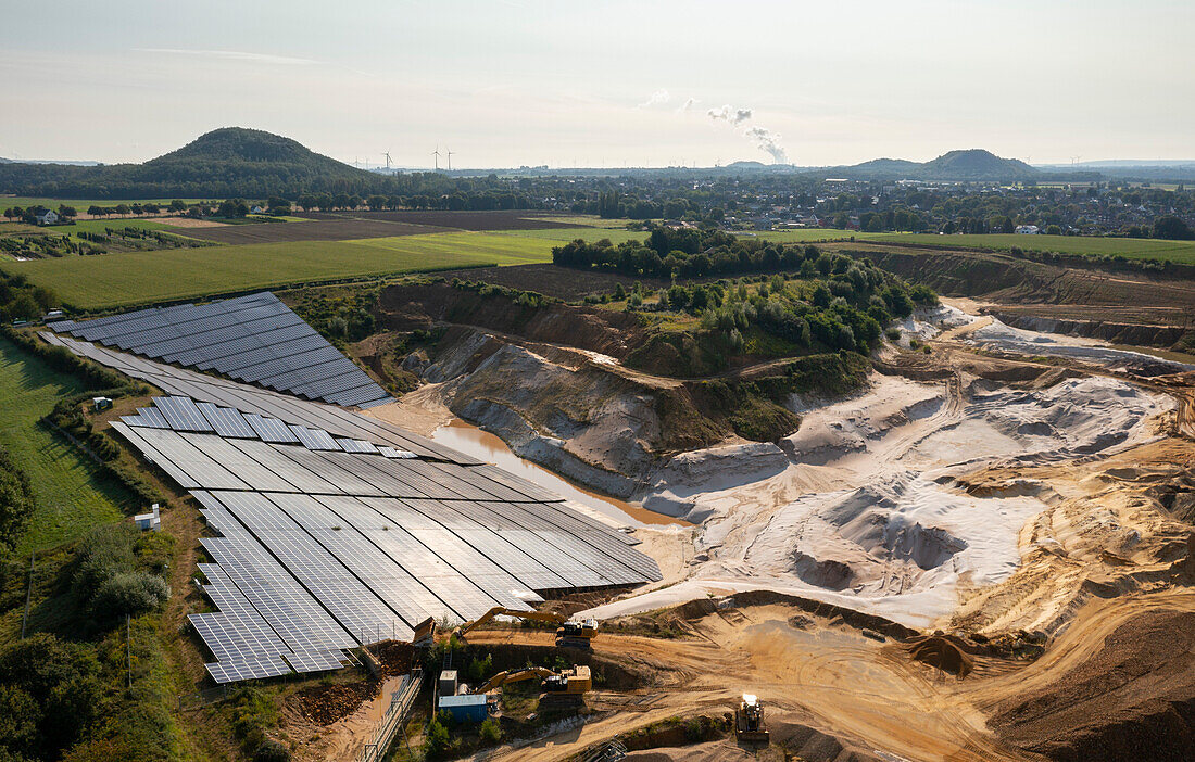 Germany, Herzogenrath, Aerial view of solar panels at sand mine