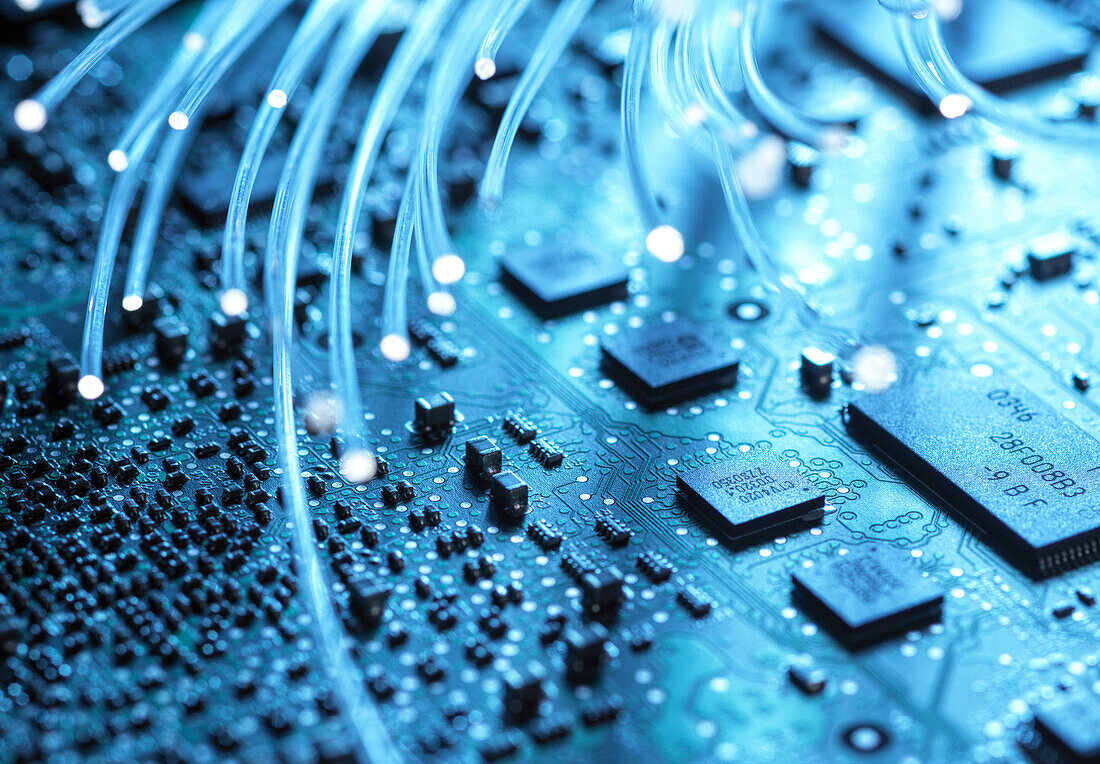 Close-up of fibre optics and computer circuit board