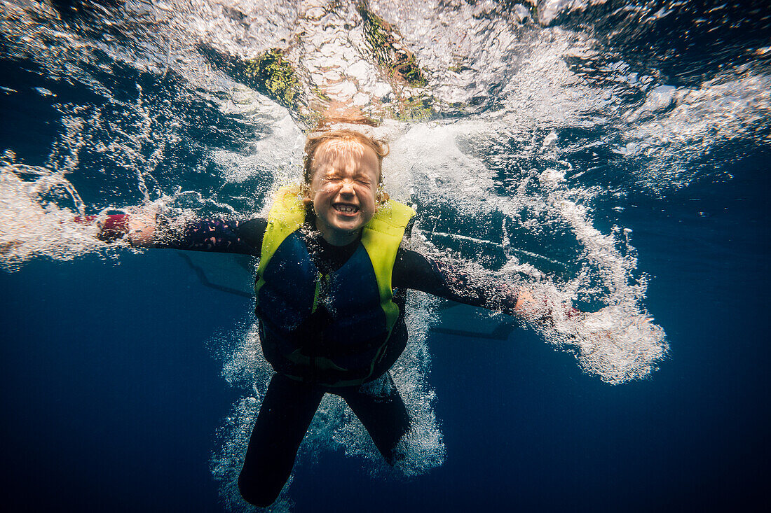 Girl (6-7) diving in lake