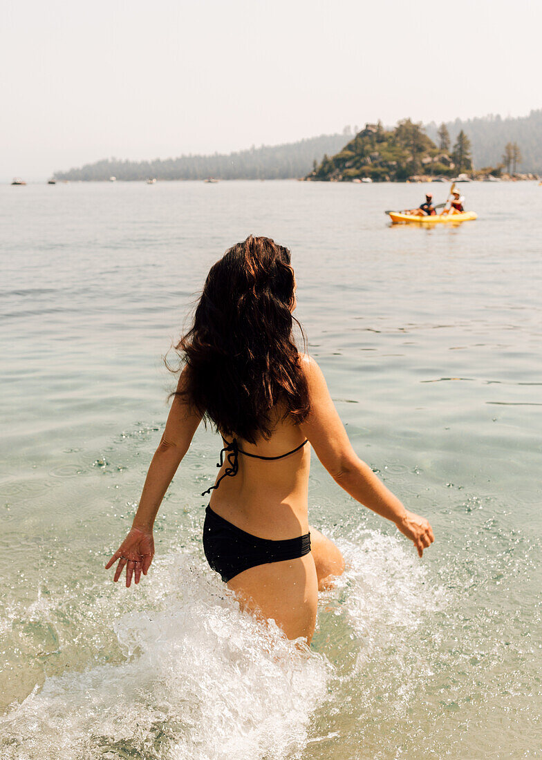 Woman walking in lake