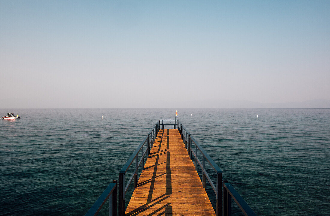 Wooden jetty and lake