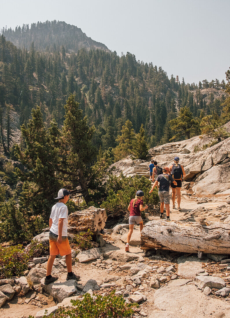 Family with children (6-7, 8-9, 12-13) hiking