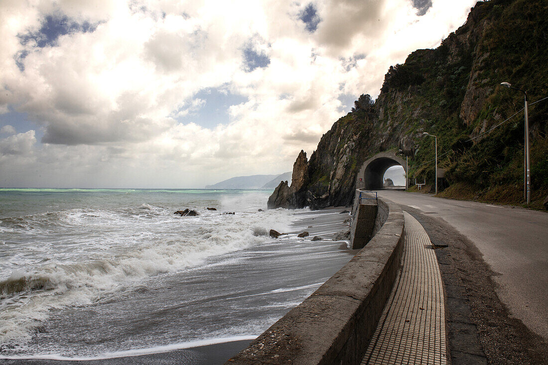 Sea and coastal road with tunnel, Sicily, Italy