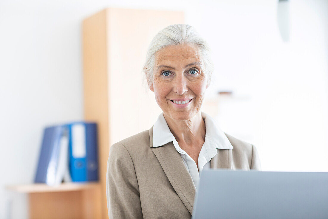 Portrait of mature businesswoman in office