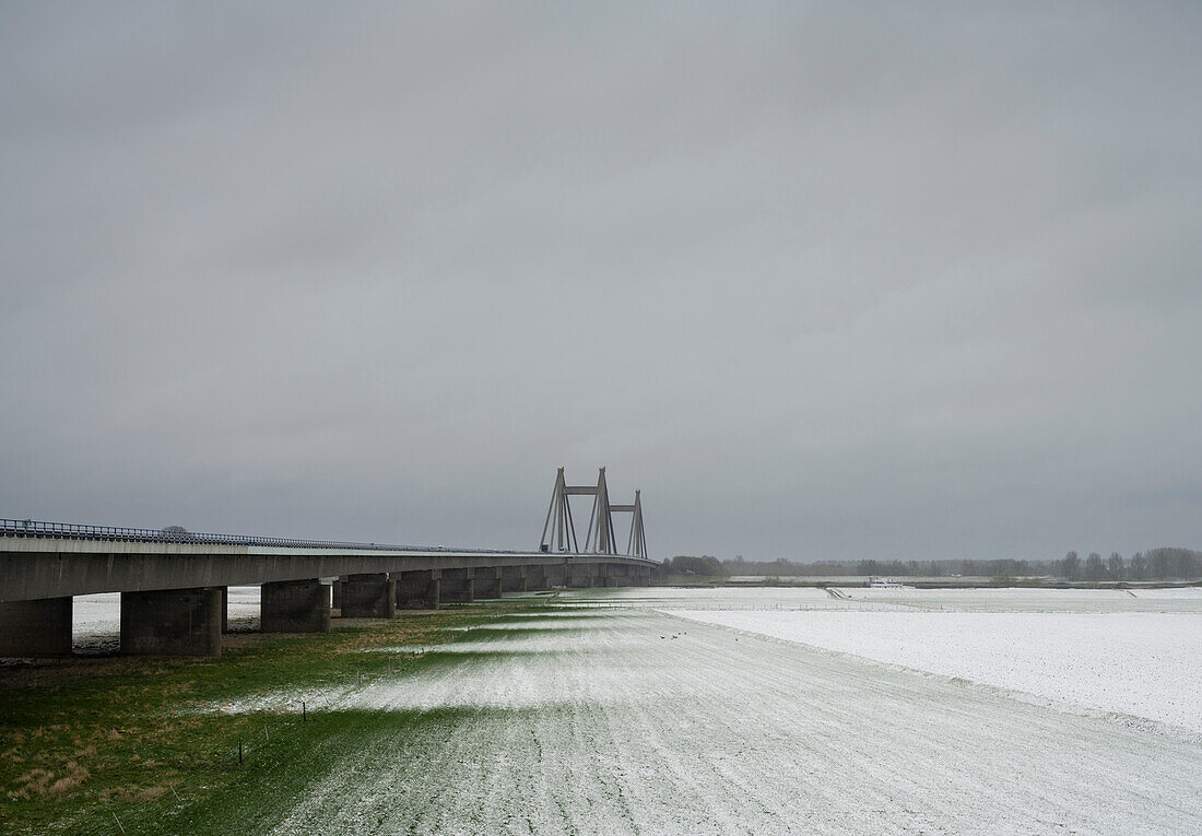 Floodlands and bridge around river Waal in winter