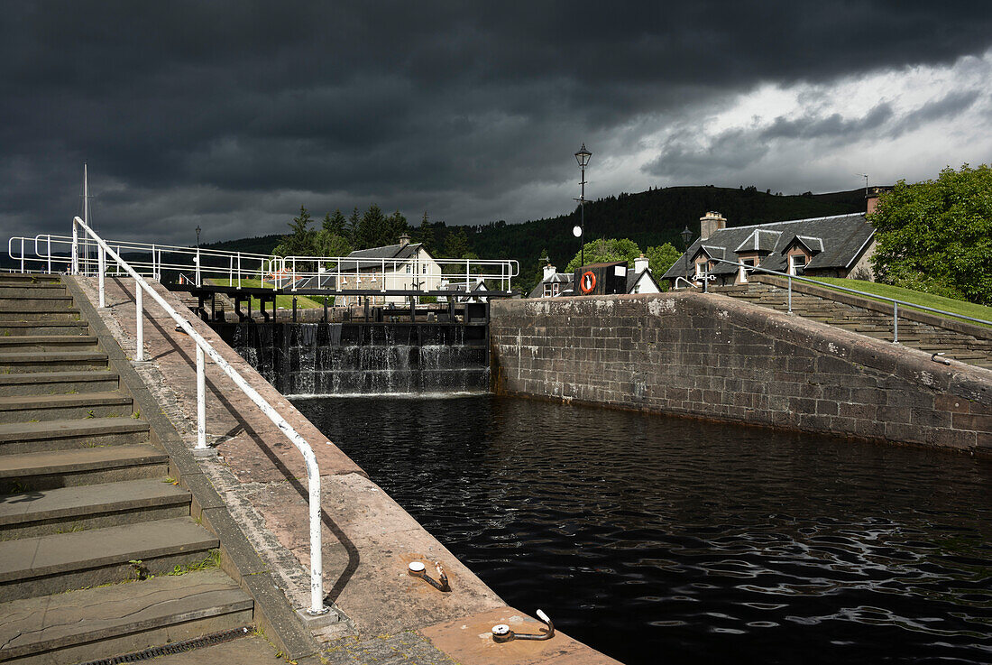 UK, Scotland, Storm clouds over canal lock