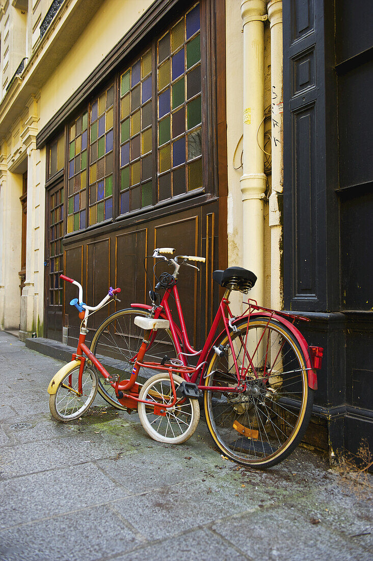 Bicycles Parked Outside A Residential Building In The Historical District Of The Marais; Paris, France