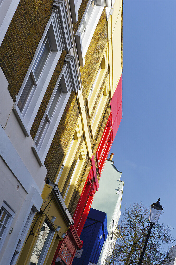 Colourful Facades Of Buildings In A Row, Portobello Road; London, England