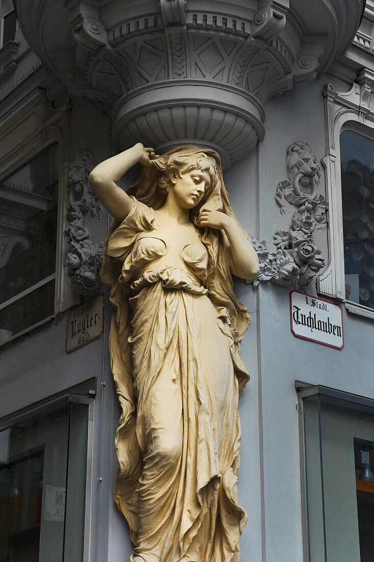 Statue Of A Woman On The Corner Of A Building; Vienna, Austria