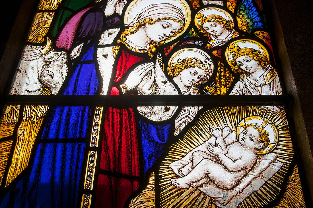 Colourful Stained Glass Window Of The Birth Of Jesus Christ At St. John The Baptist Church, Horsington Village; Somerset, England