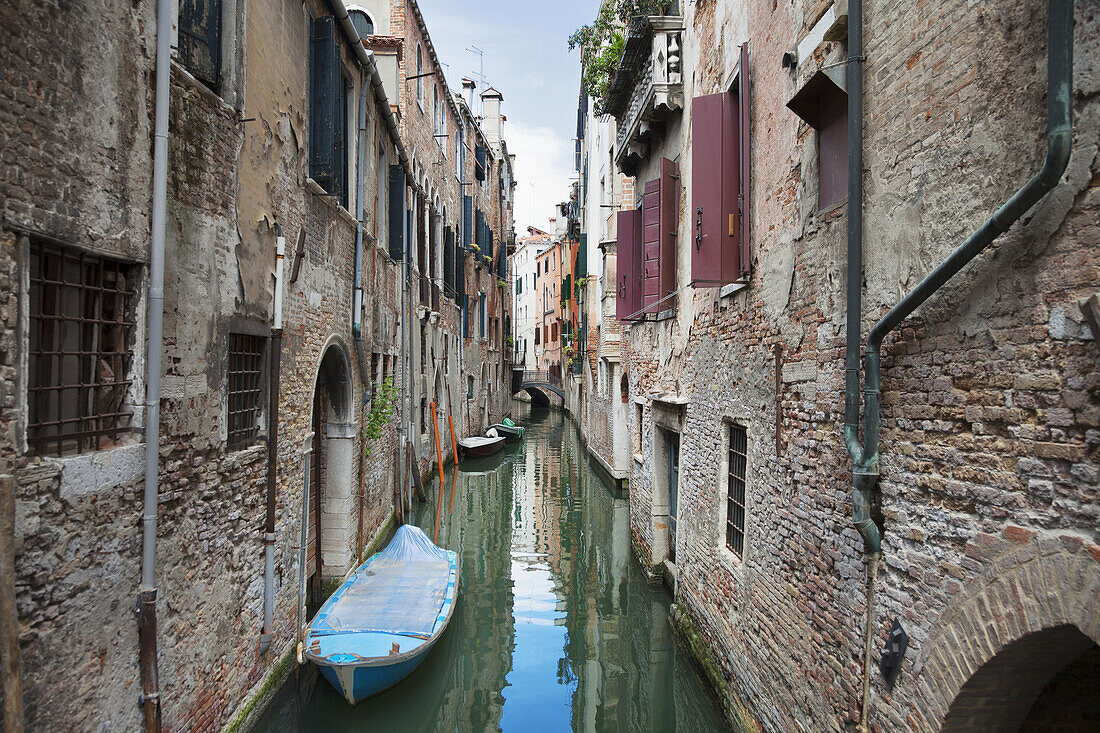 A Small Canal With Boats; Venice, Italy