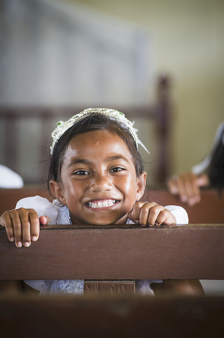 Young Girl On Wooden Bench In Church On Hapai Island; Tonga