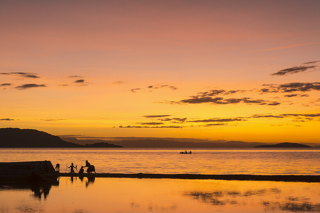 Silhouette Of People On Beach At Cape Maclear, Lake Malawi; Malawi