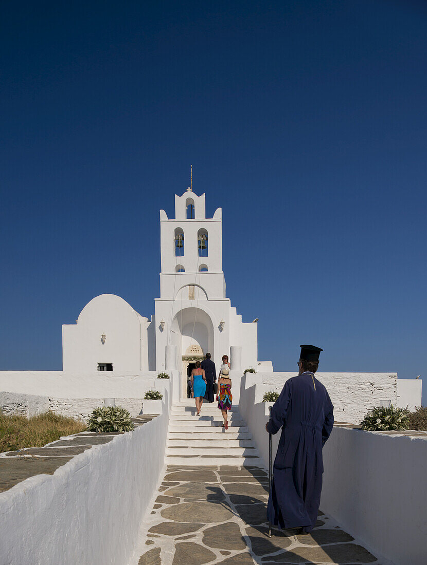 A Priest Arriving At The Chrysopiyi Monastery; Sifnos, Cyclades, Greek Islands, Greece