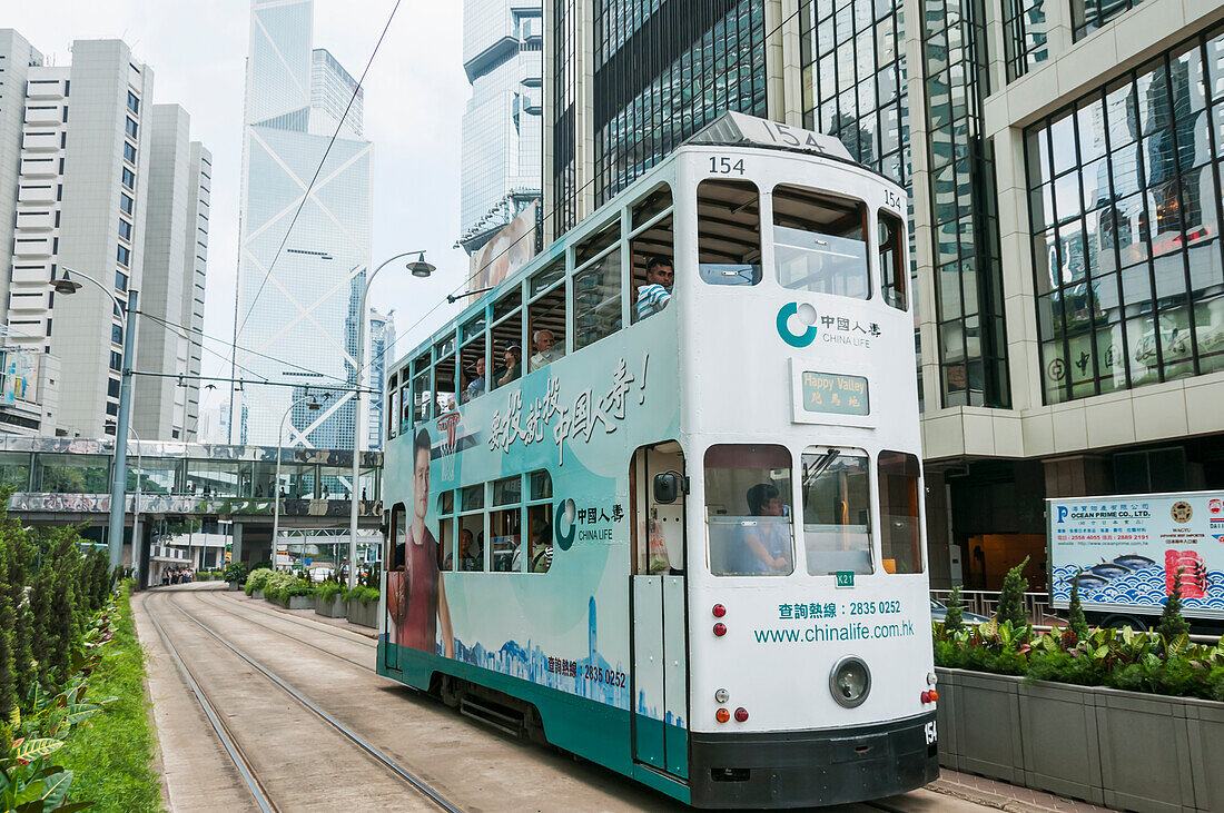 A Tram With Some Skyscrapers As Background; Hong Kong, China