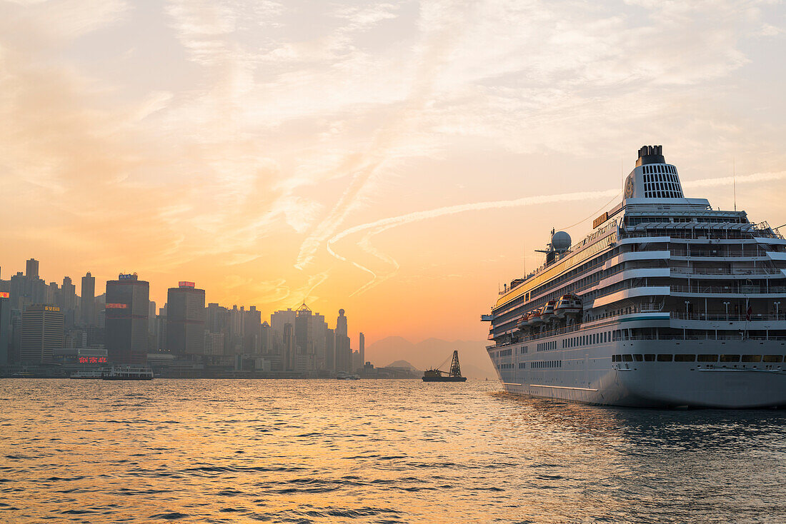 Cruise Ship In The Harbour At Sunset, Kowloon; Hong Kong, China