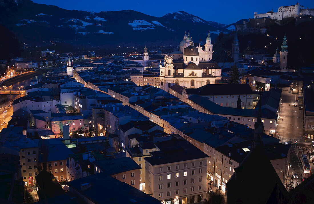 Domes Of The Cathedral And Rooftops Of The Historic Centre And Castle At Dusk, Seen From Monchsberg; Salzburg, Austria