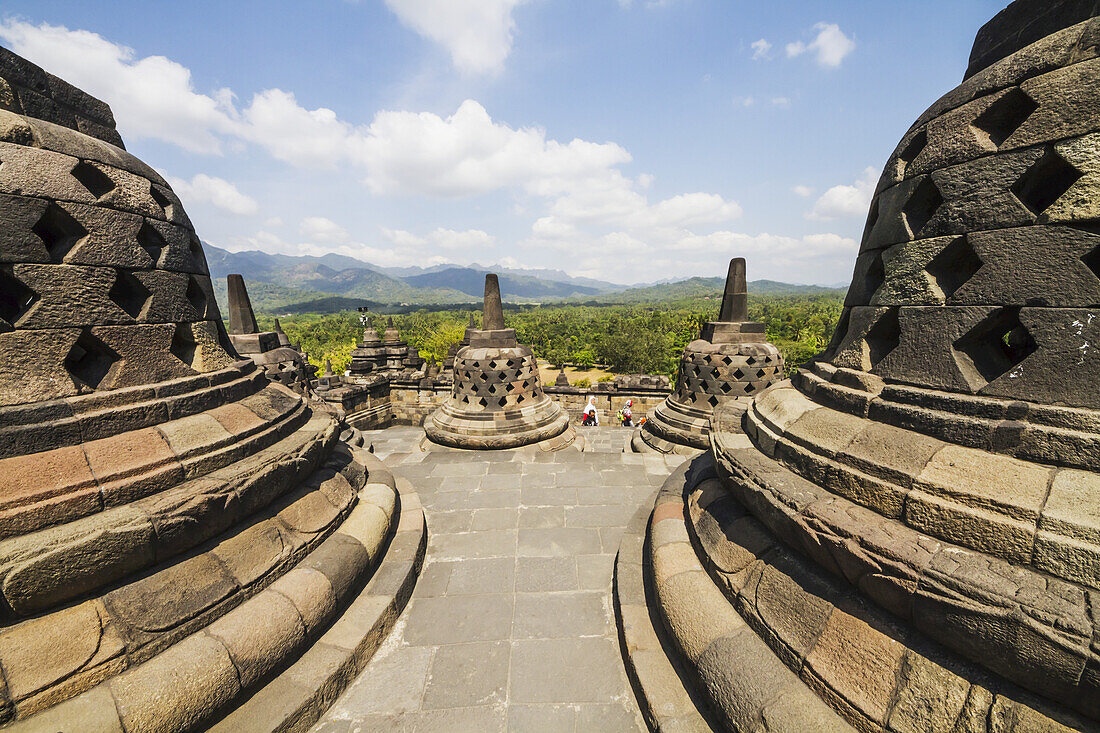 Latticed Stone Stupas Containing Buddha Statues On The Upper Terrace, Borobudur Temple Compounds, Central Java, Indonesia