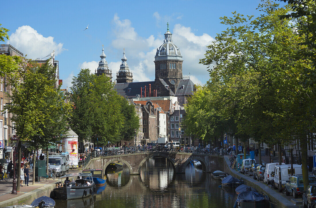 St. Nicolas Church In The Background With Canal In Foreground; Amsterdam, Holland