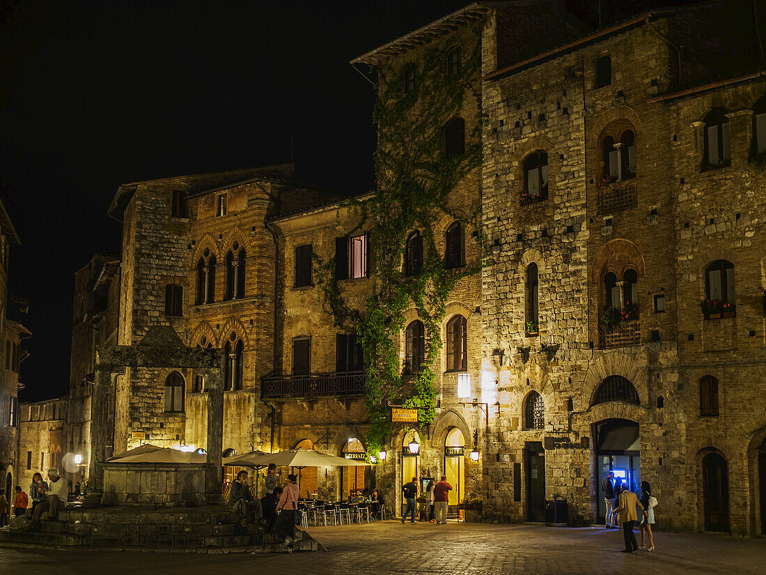 A Nighttime View Of The Piazza In San Gimingano, A Small Walled Tuscan Town In Italy; San Gimignano, Siena, Italy