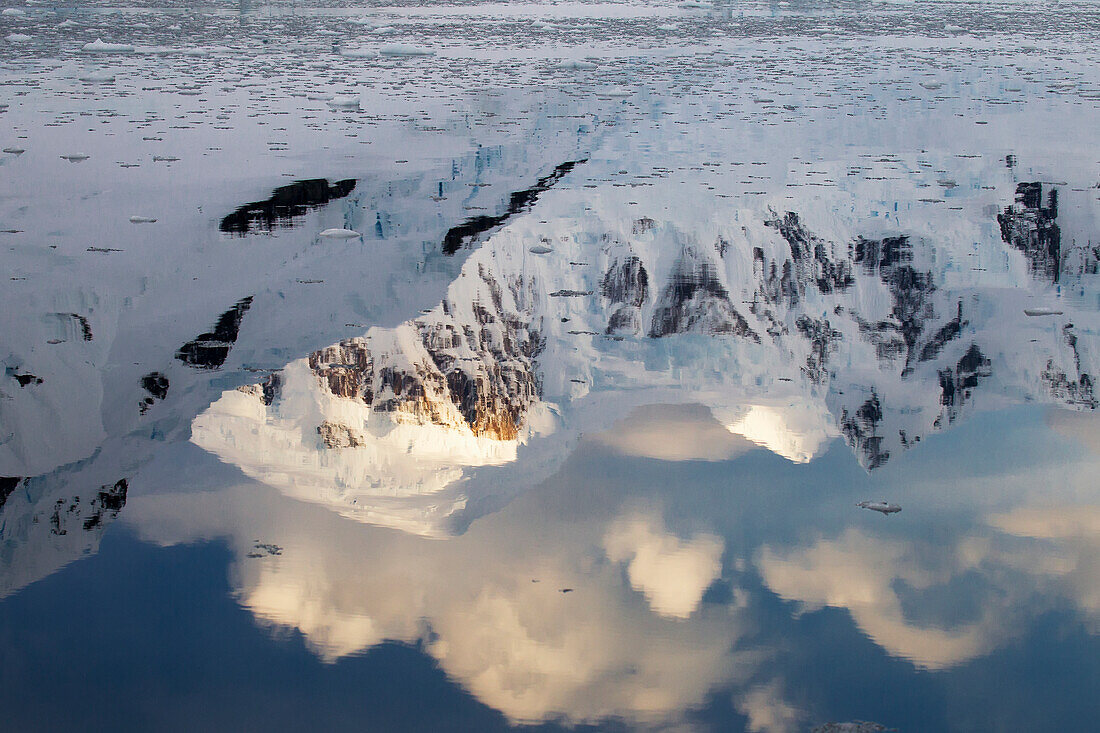 Sun On Mountains In Paradise Harbor, Antarctic Peninsula; Antarctica