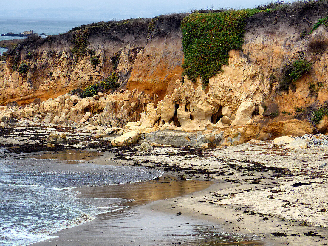 Rugged rock formations on cliffs along the Pacific Ocean