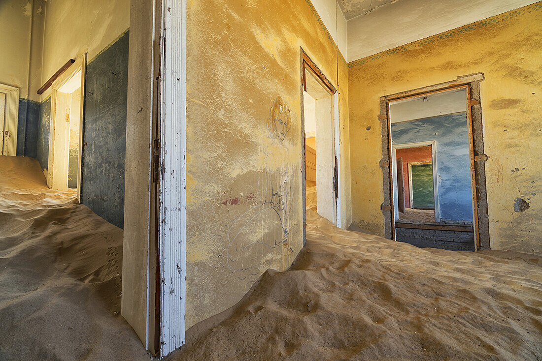 Drifting Sand Fills The Rooms Of A Colourful Abandoned House; Kolmanskop, Namibia