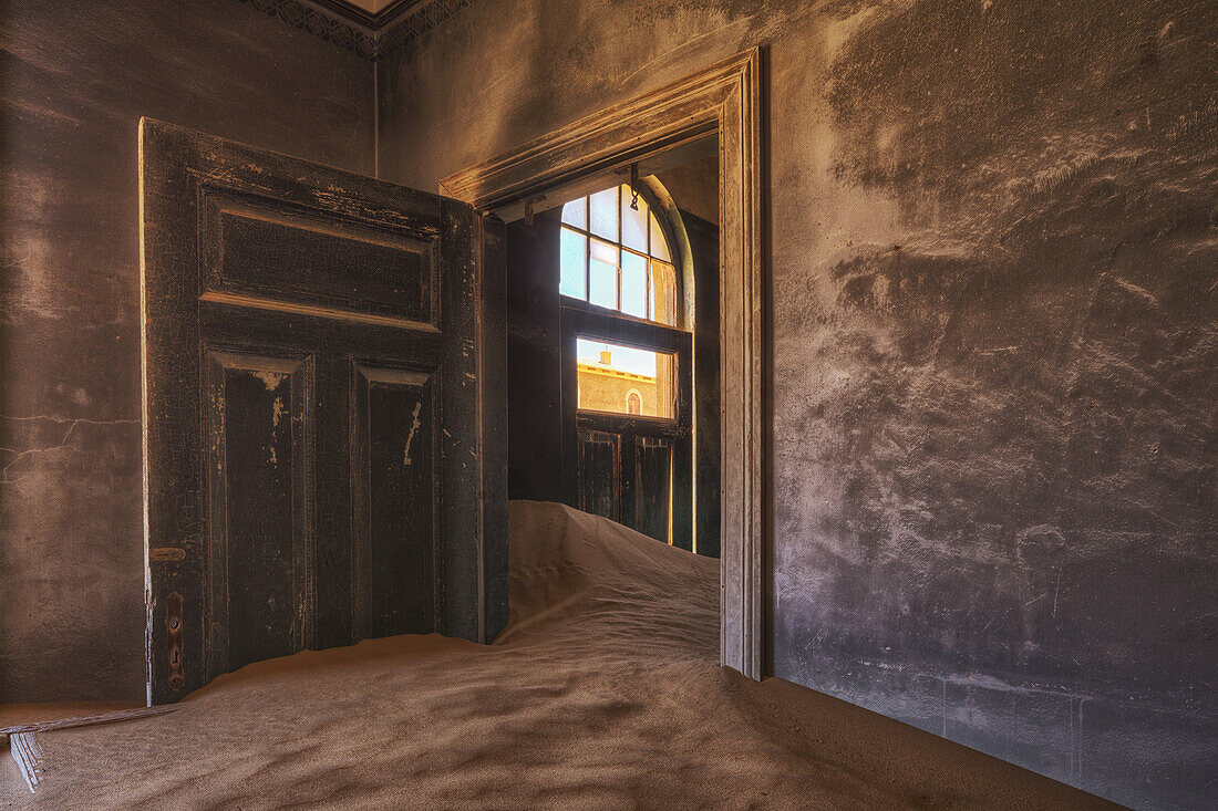 Sand In The Rooms Of A Colourful And Abandoned House; Kolmanskop, Namibia