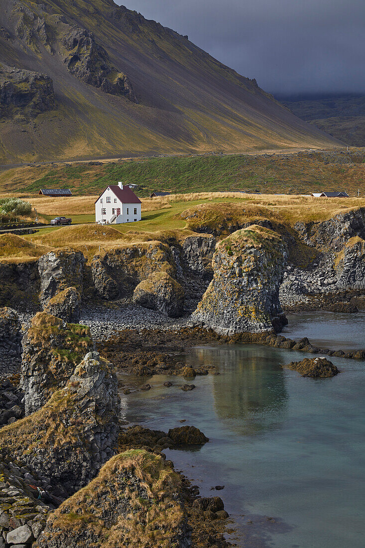 House and basaltic lava cliffs at Arnastapi, Snaefellsnes, Iceland; Iceland