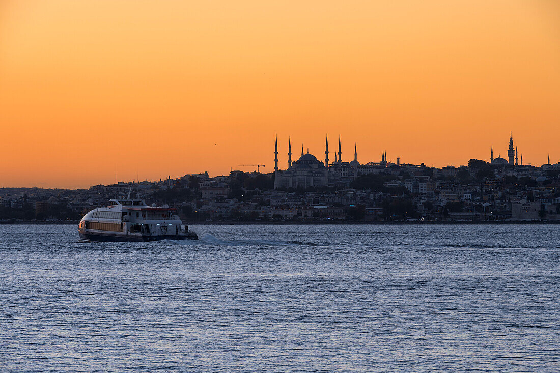 View of the Blue Mosque and Hagia Sophia at sunset from Kadikoy in Istanbul; Istanbul, Turkey