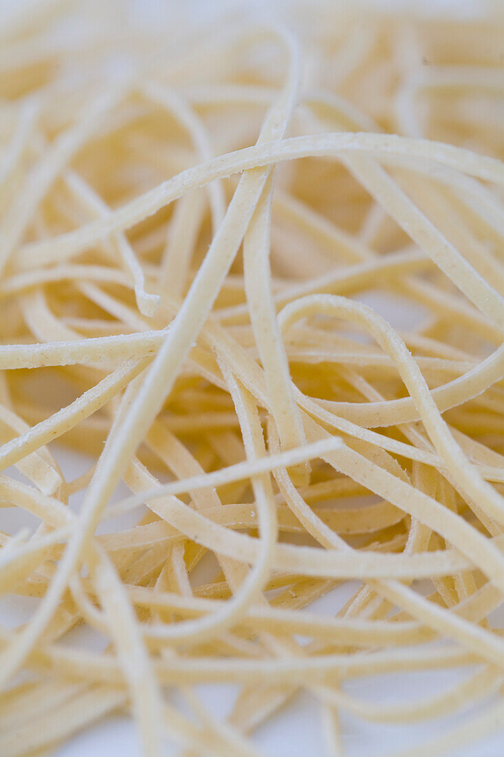 Extreme close up of fresh egg pasta tagliatelle